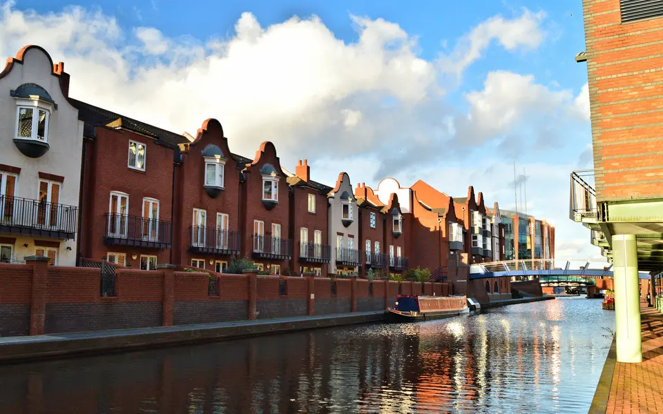 A canal and surrounding buildings in Birmingham city centre, photographed in 2016.