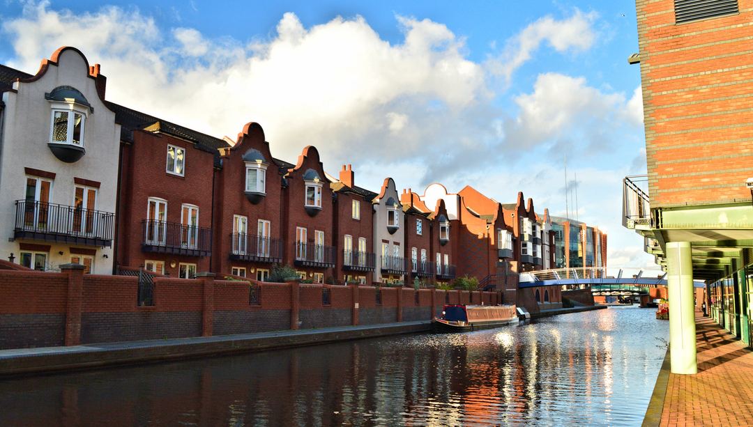 A canal and surrounding buildings in Birmingham city centre, photographed in 2016.